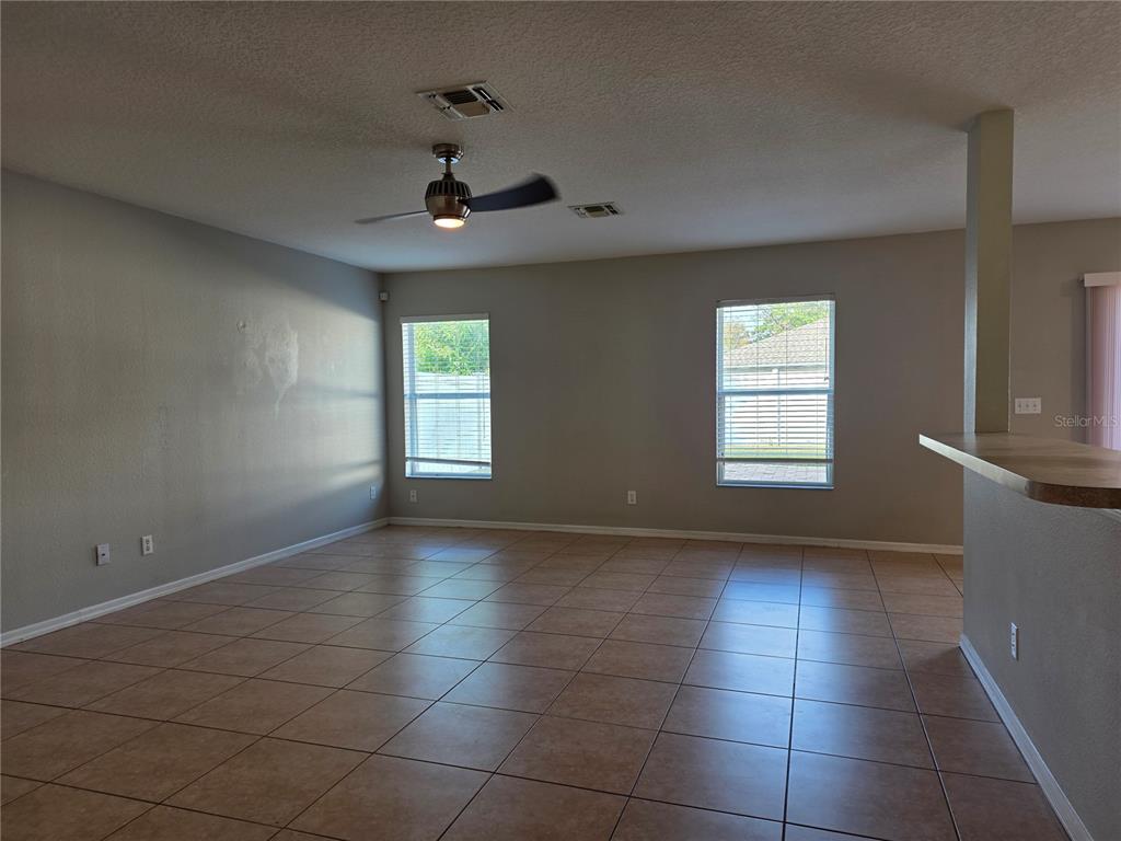 1645 Algonkin Loop Orlando, FL 32828 - Photo 6 of 37 a view of an empty room with a window