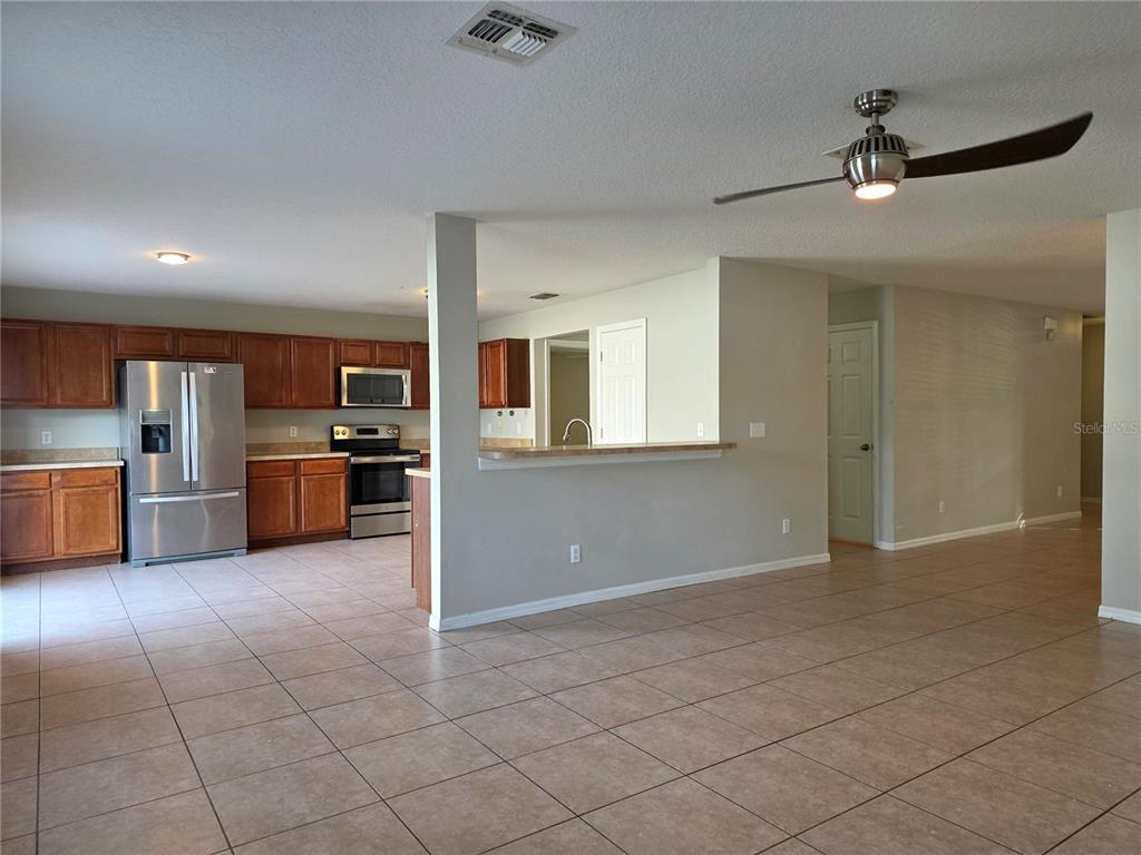 1645 Algonkin Loop Orlando, FL 32828 - Photo 7 of 37 a view of kitchen with wooden floor