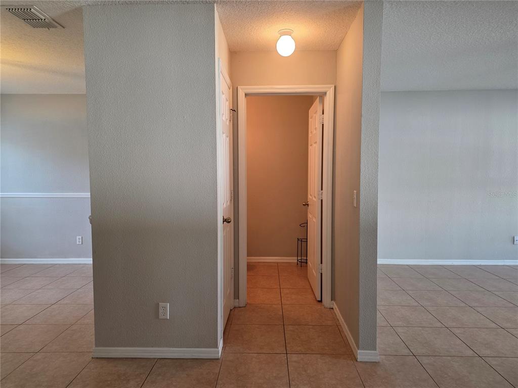 1645 Algonkin Loop Orlando, FL 32828 - Photo 9 of 37 a view of a hallway with a door