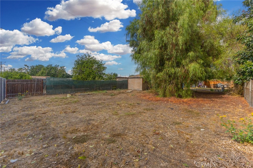 18585 14th Street Bloomington, CA 92316 - Photo 13 of 19 a view of a yard with tree s