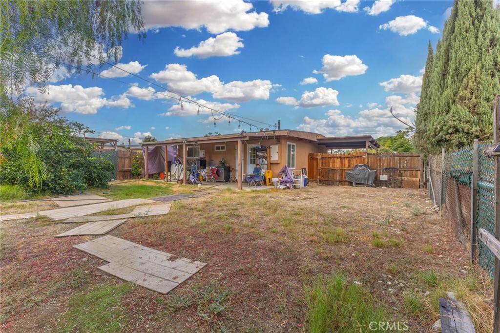 18585 14th Street Bloomington, CA 92316 - Photo 18 of 19 a view of a house with a yard