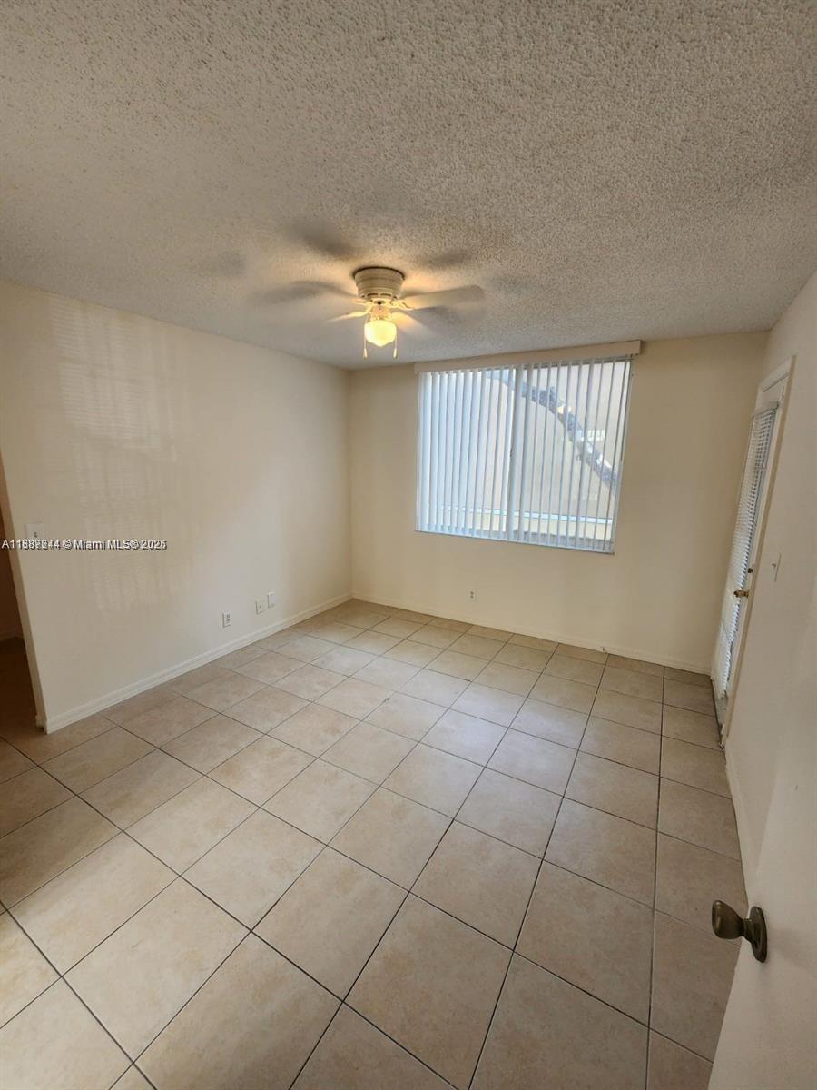Palm Aire Pompano Beach, FL 33069 - Photo 2 of 8 a view of an empty room with a window