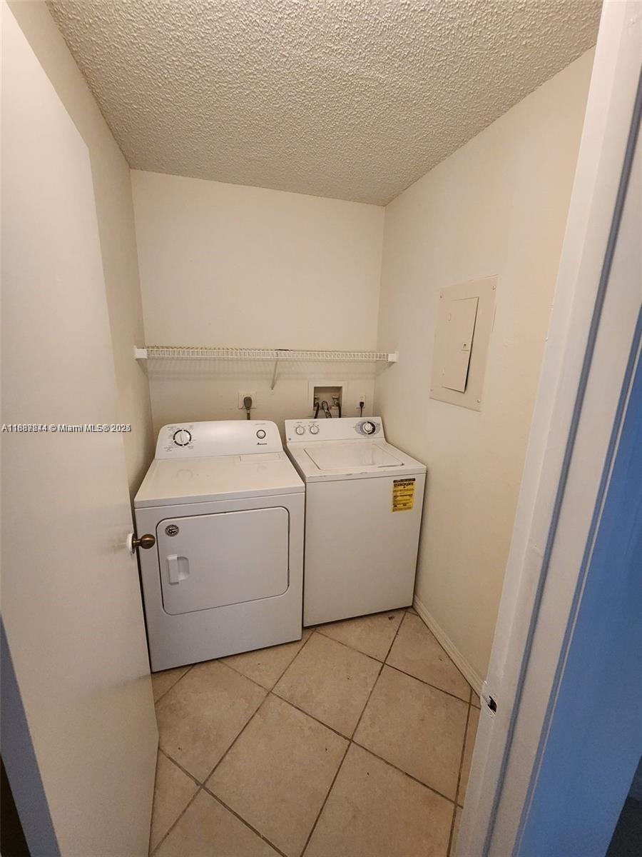 Palm Aire Pompano Beach, FL 33069 - Photo 7 of 8 a utility room with dryer and washer