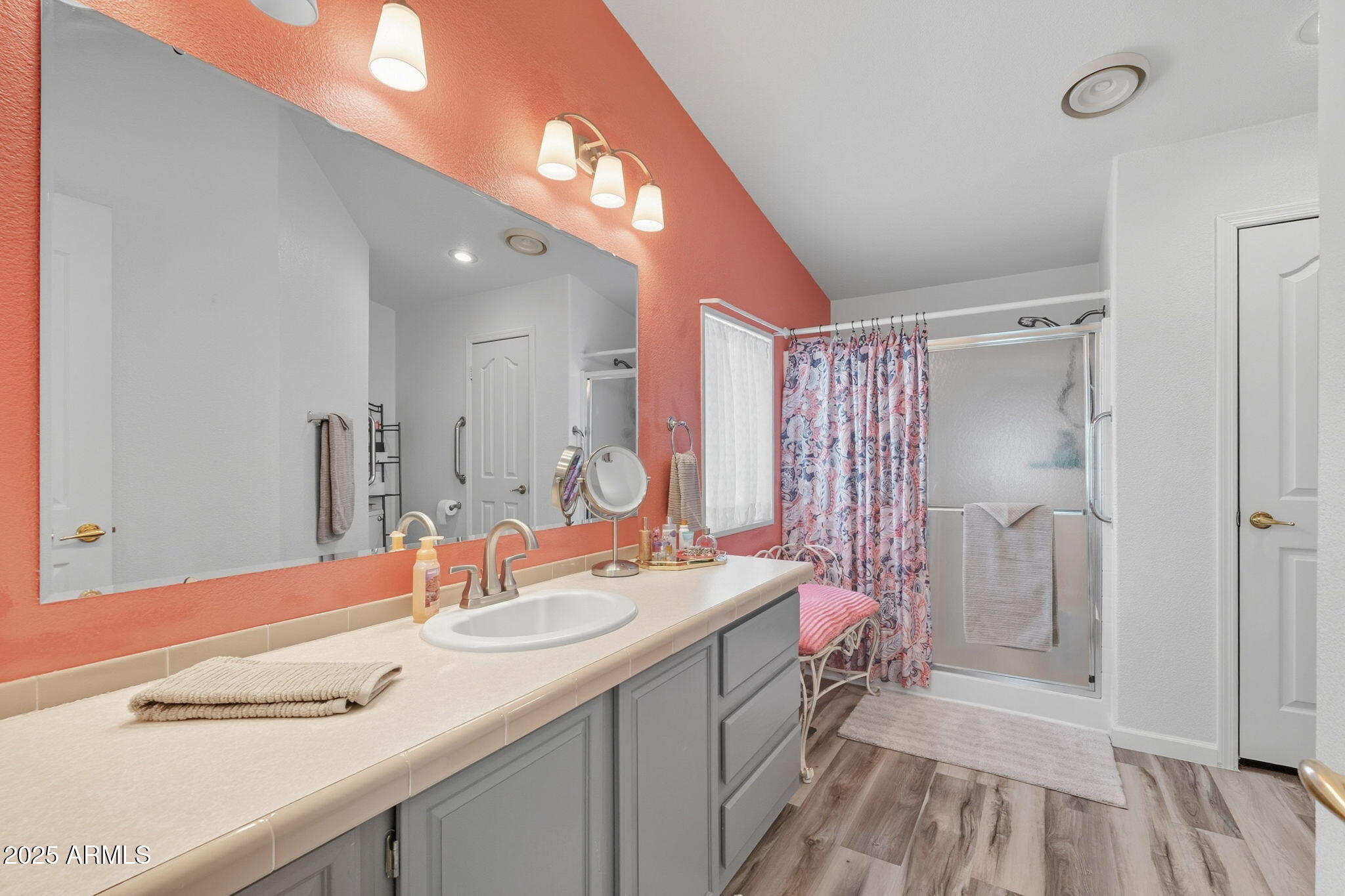 3700 South Tomahawk Road, Unit 39 Apache Junction, AZ 85119 - Photo 5 of 53 a bathroom with a double vanity sink mirror and shower