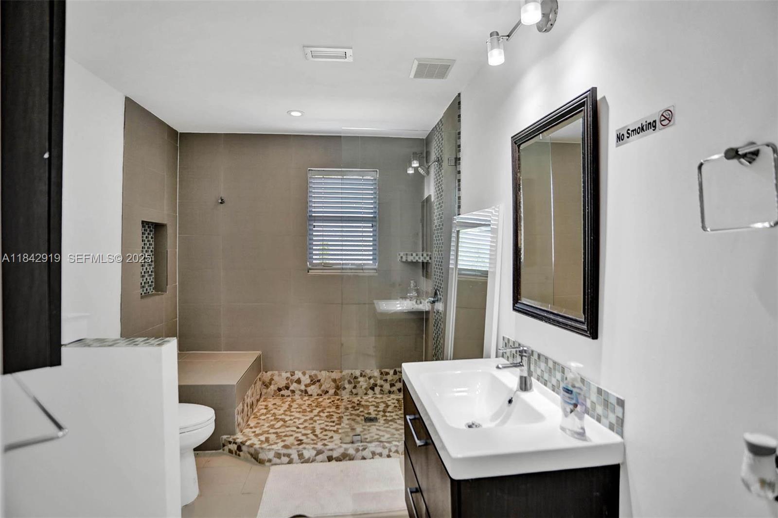 721 Ranch Road Weston, FL 33326 - Photo 29 of 38 a bathroom with a sink and a mirror