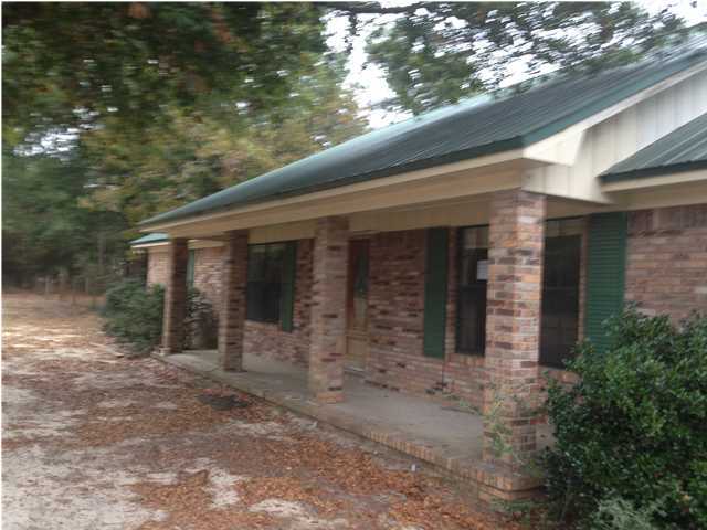1086 Tallokas Road Crestview, FL 32536 - Photo 2 of 34 a view of house with backyard and garden