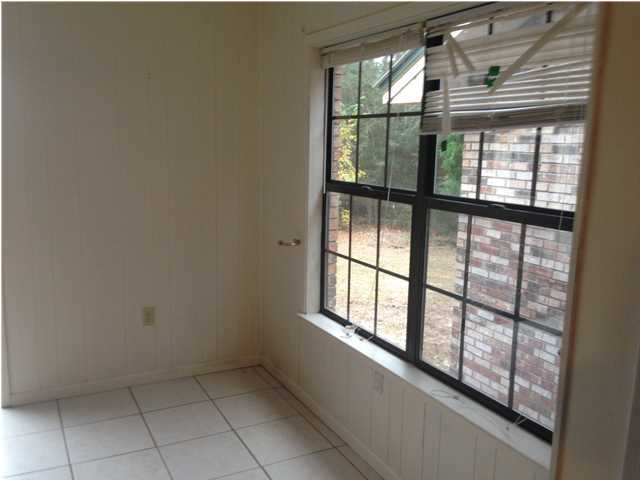 1086 Tallokas Road Crestview, FL 32536 - Photo 12 of 34 a view of an empty room with a window