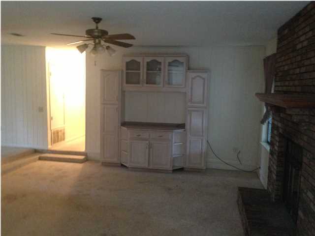 1086 Tallokas Road Crestview, FL 32536 - Photo 15 of 34 a living room with a fireplace furniture and a window
