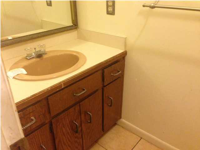 1086 Tallokas Road Crestview, FL 32536 - Photo 24 of 34 a bathroom with a sink and a mirror
