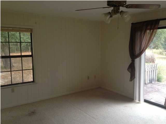 1086 Tallokas Road Crestview, FL 32536 - Photo 27 of 34 an empty room with windows