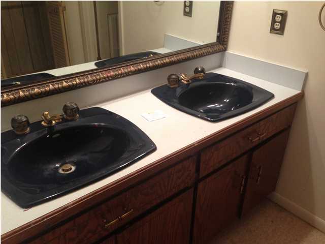 1086 Tallokas Road Crestview, FL 32536 - Photo 28 of 34 a close up of a sink and cabinets