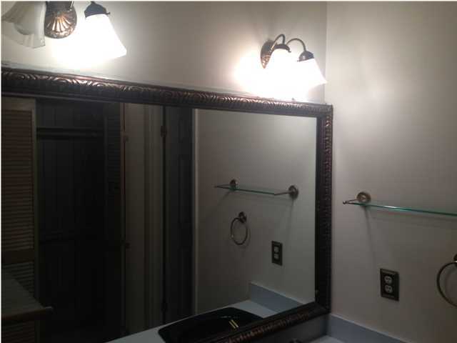 1086 Tallokas Road Crestview, FL 32536 - Photo 29 of 34 a bathroom with a granite countertop sink and mirror