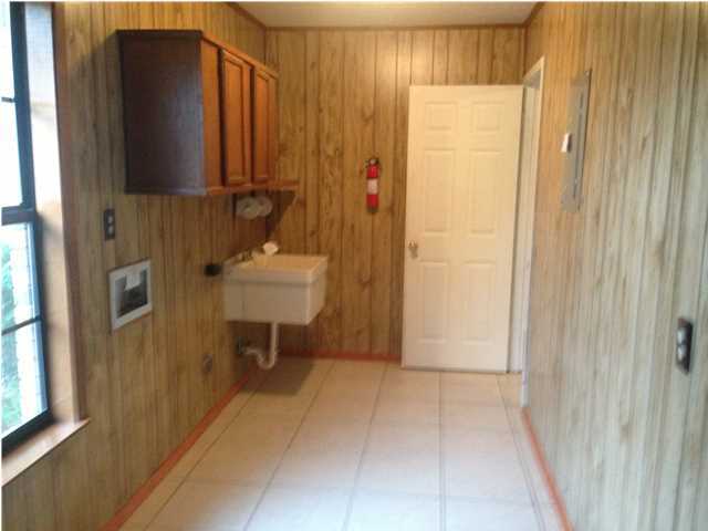 1086 Tallokas Road Crestview, FL 32536 - Photo 6 of 34 a bathroom with a sink and a mirror