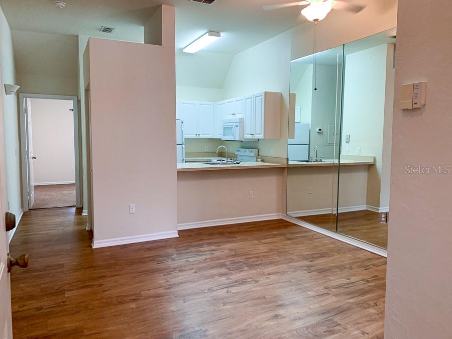 3901 Southwest 27th Street, Unit 5 Gainesville, FL 32608 - Photo 2 of 15 a view of a room with wooden floor