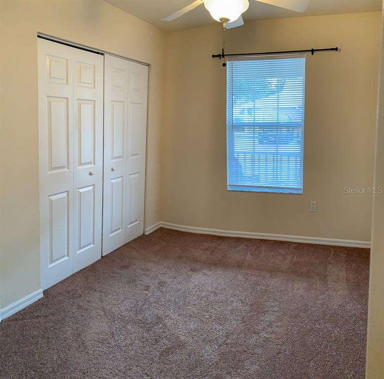 3901 Southwest 27th Street, Unit 5 Gainesville, FL 32608 - Photo 7 of 15 an empty room with windows
