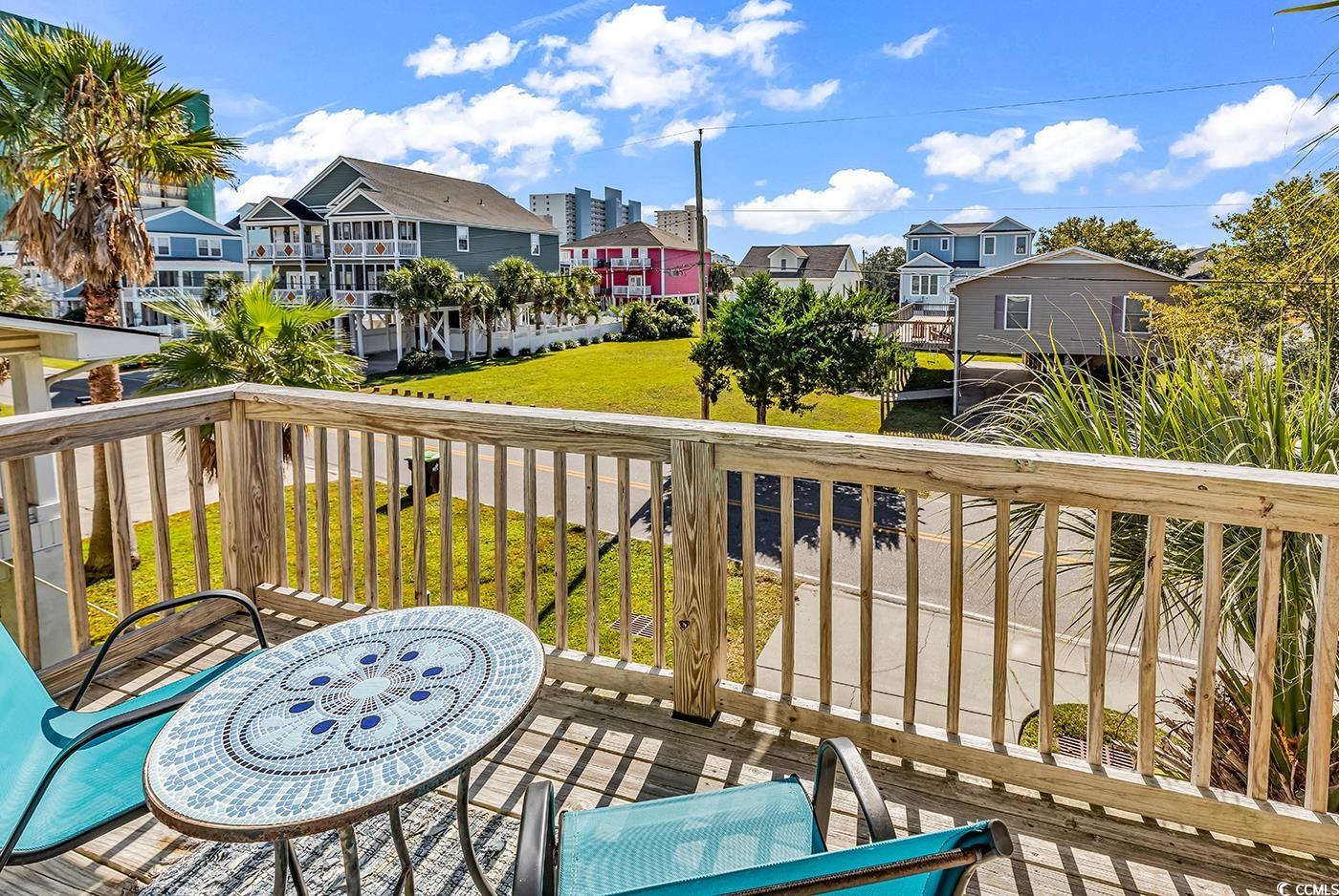 124 B Vista Drive Murrells Inlet, SC 29576 - Photo 8 of 38 Wooden deck featuring a residential view and a yard