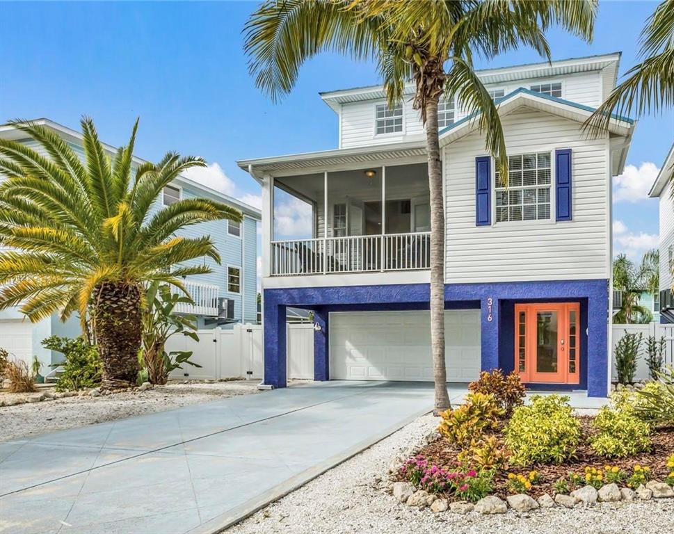 316 64th Street Holmes Beach, FL 34217 - Photo 1 of 43 front view of a house