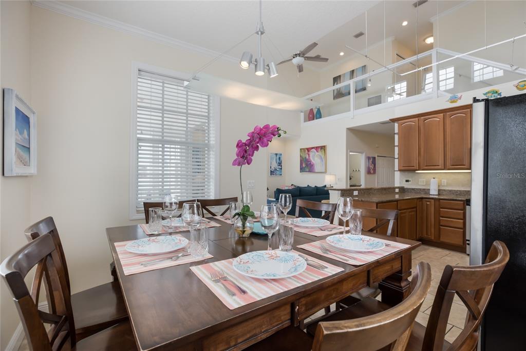 316 64th Street Holmes Beach, FL 34217 - Photo 15 of 43 a view of a dining room with furniture