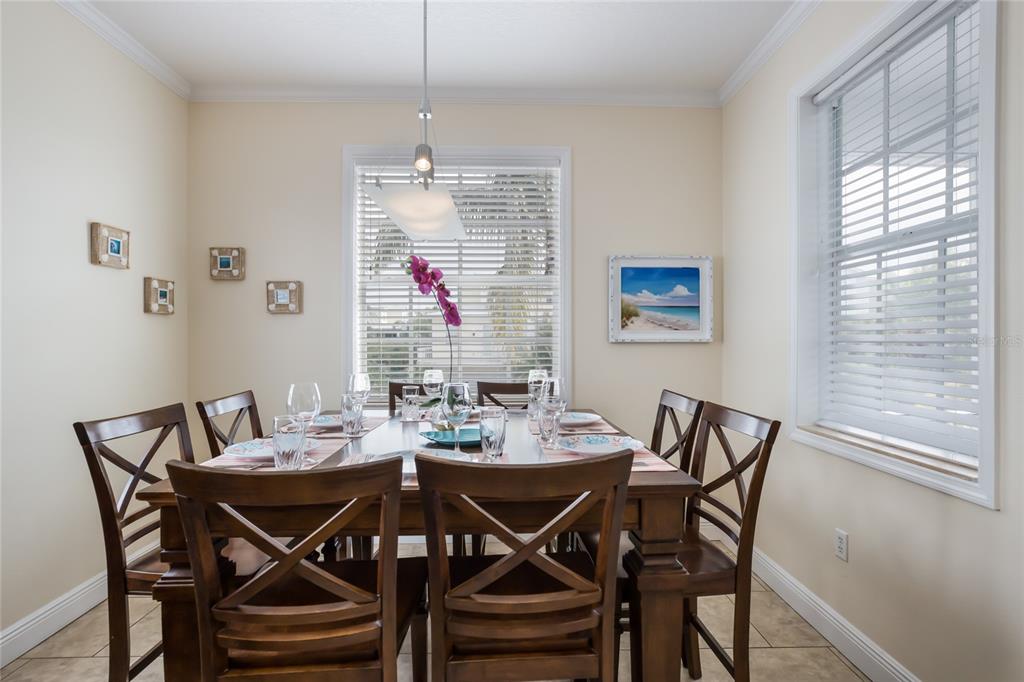 316 64th Street Holmes Beach, FL 34217 - Photo 16 of 43 a view of a dining room with furniture window and outside view