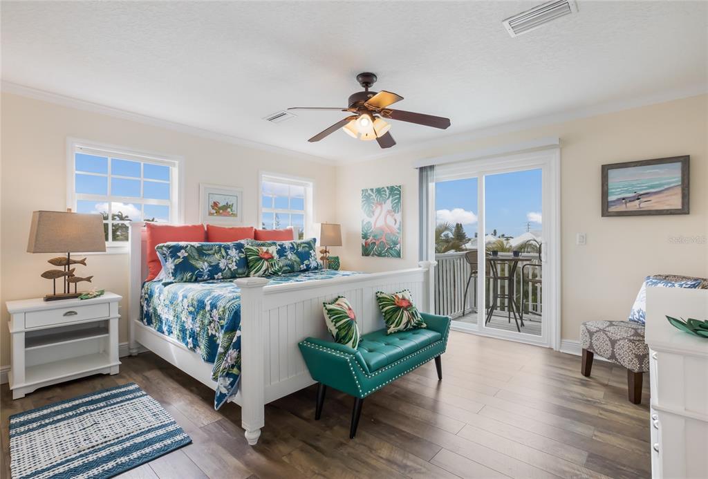 316 64th Street Holmes Beach, FL 34217 - Photo 20 of 43 a living room with furniture and a flat screen tv