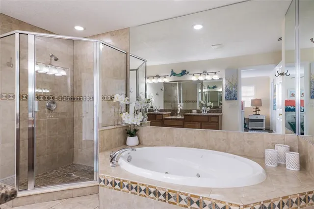 a bathroom with a bathtub and a shower