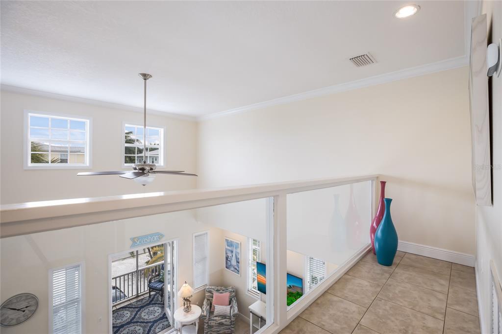 316 64th Street Holmes Beach, FL 34217 - Photo 30 of 43 a view of an empty room with window and hardwood floor