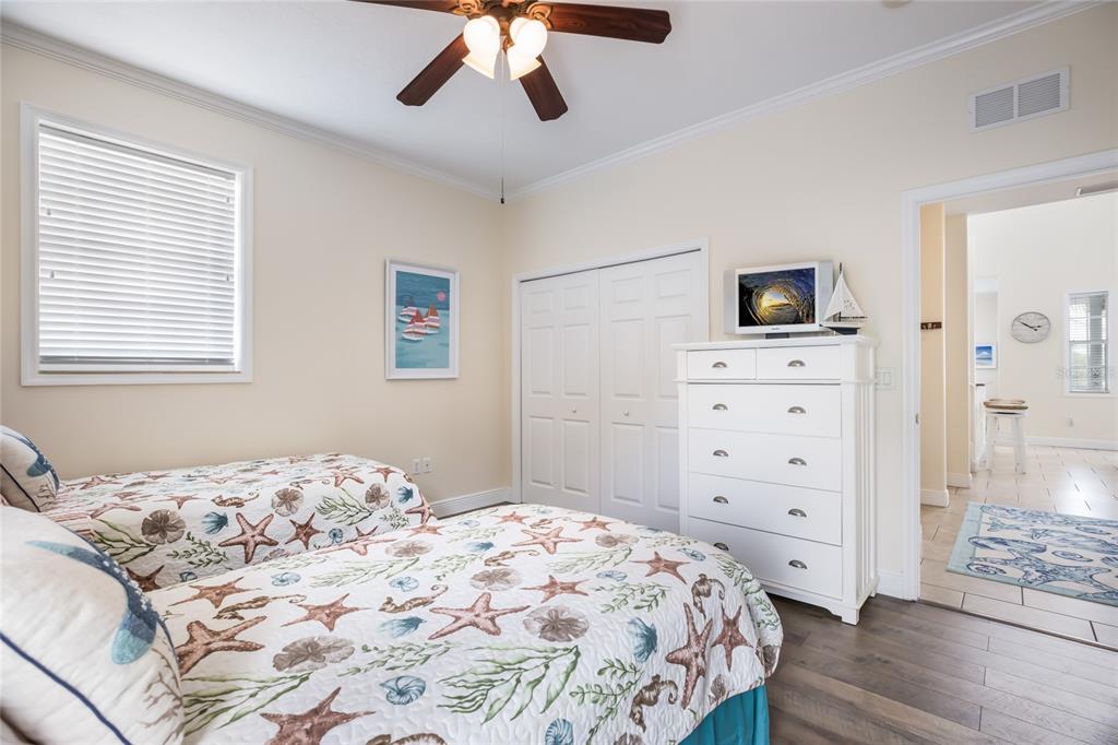 316 64th Street Holmes Beach, FL 34217 - Photo 31 of 43 a bedroom with a bed and a tv