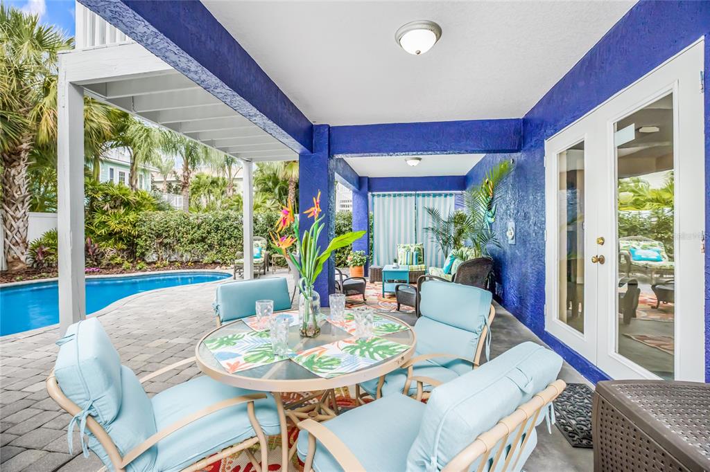 316 64th Street Holmes Beach, FL 34217 - Photo 34 of 43 a view of a dining room with furniture window and wooden floor