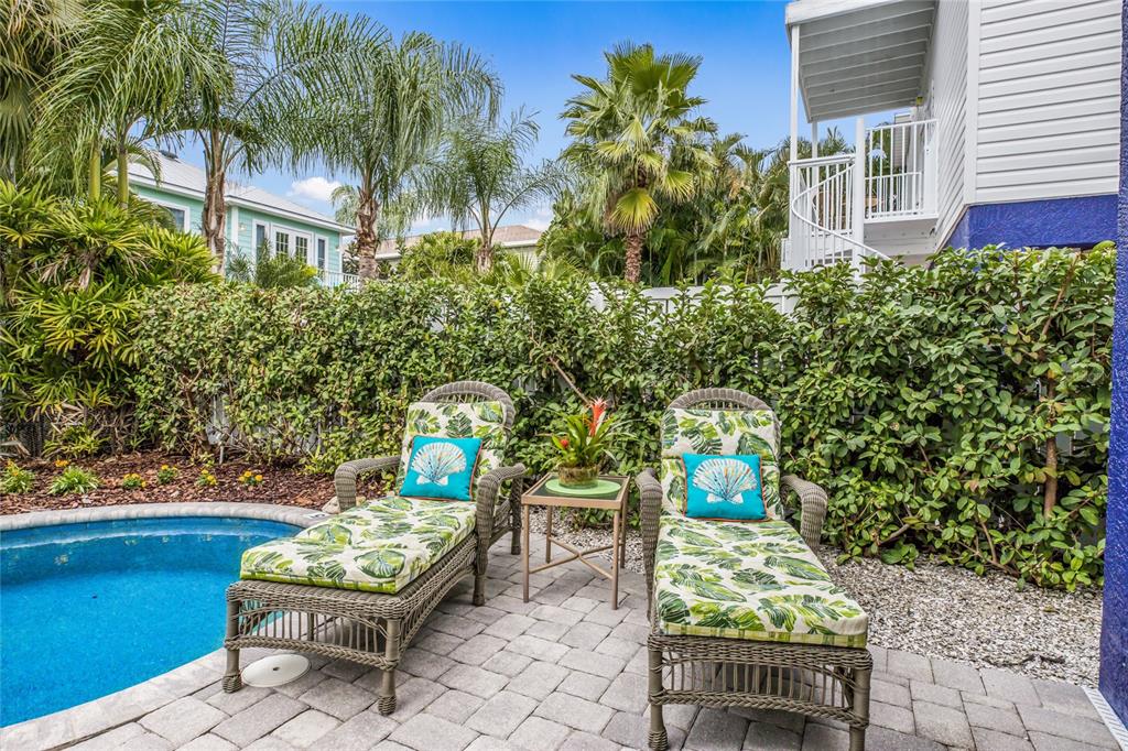 316 64th Street Holmes Beach, FL 34217 - Photo 35 of 43 a view of a chairs and table in a patio