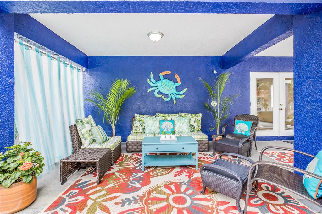 316 64th Street Holmes Beach, FL 34217 - Photo 36 of 43 a living room with furniture and a potted plant