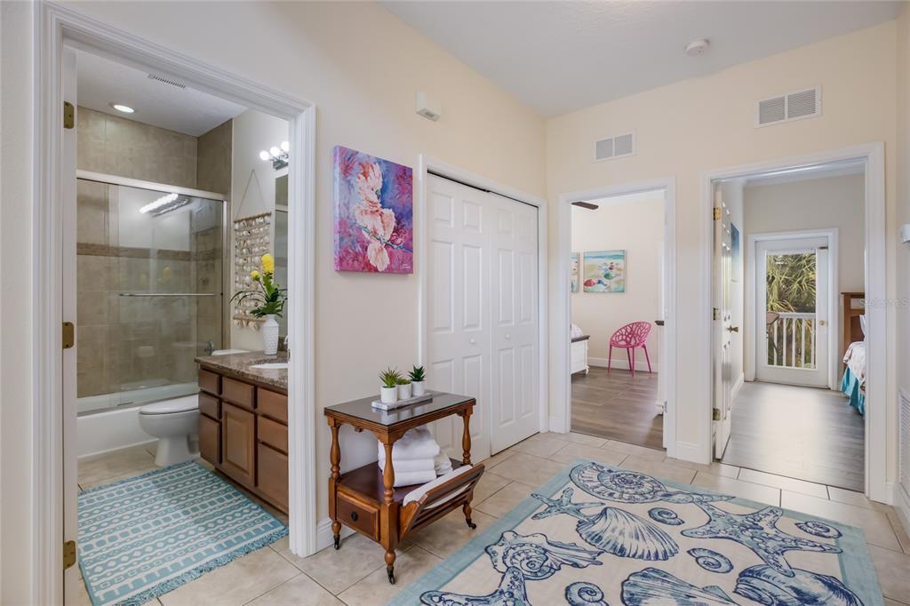 316 64th Street Holmes Beach, FL 34217 - Photo 41 of 43 a room with furniture and view of bathroom