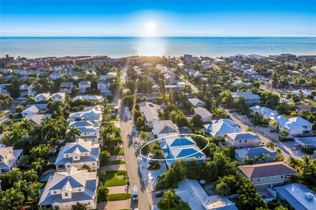 316 64th Street Holmes Beach, FL 34217 - Photo 6 of 43 an aerial view of residential building with parking