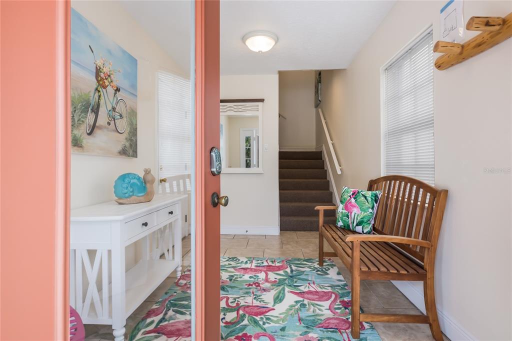 316 64th Street Holmes Beach, FL 34217 - Photo 8 of 43 a living room with furniture and a rug