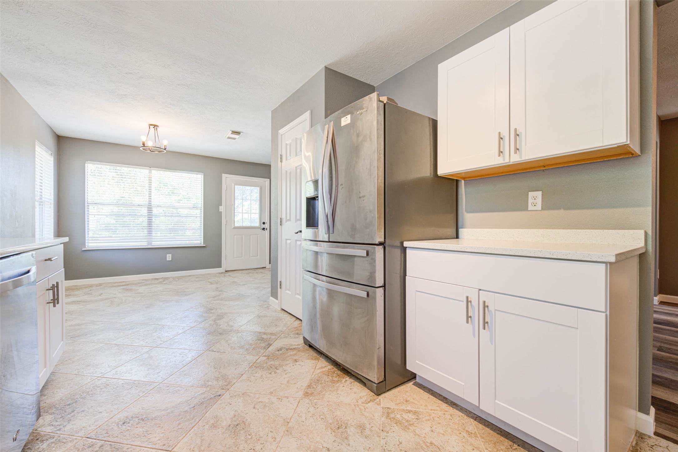 17930 Seven Pines Drive Spring, TX 77379 - Photo 14 of 26 a kitchen with stainless steel appliances a refrigerator sink and cabinets