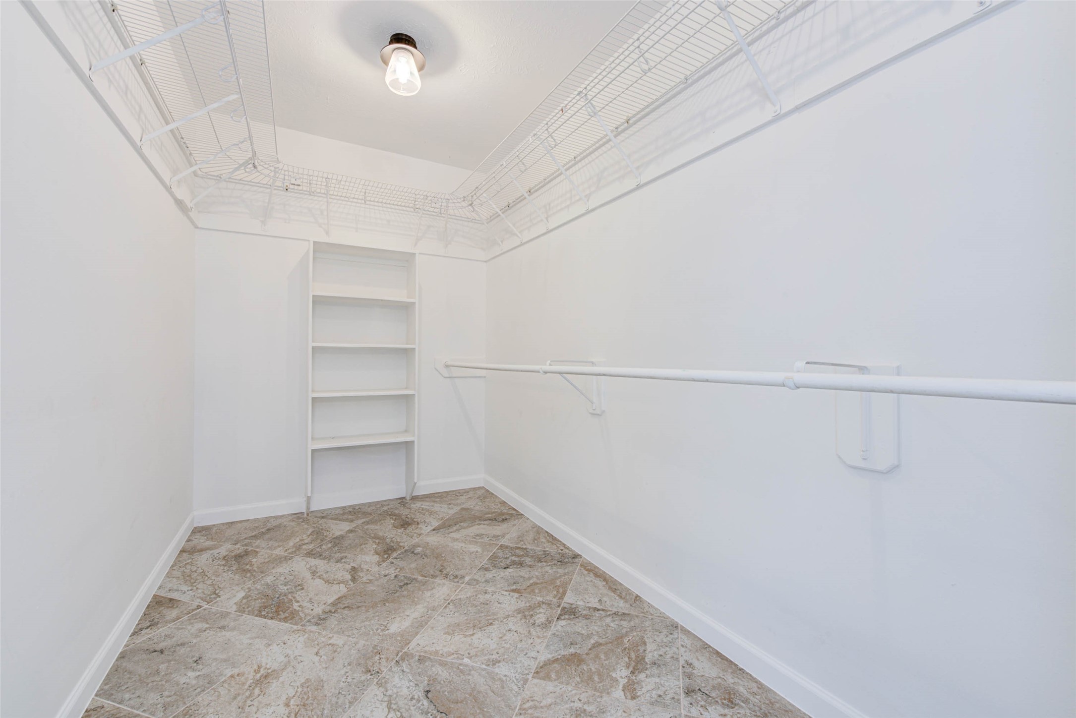 17930 Seven Pines Drive Spring, TX 77379 - Photo 18 of 26 a view of a room with racks on the wall