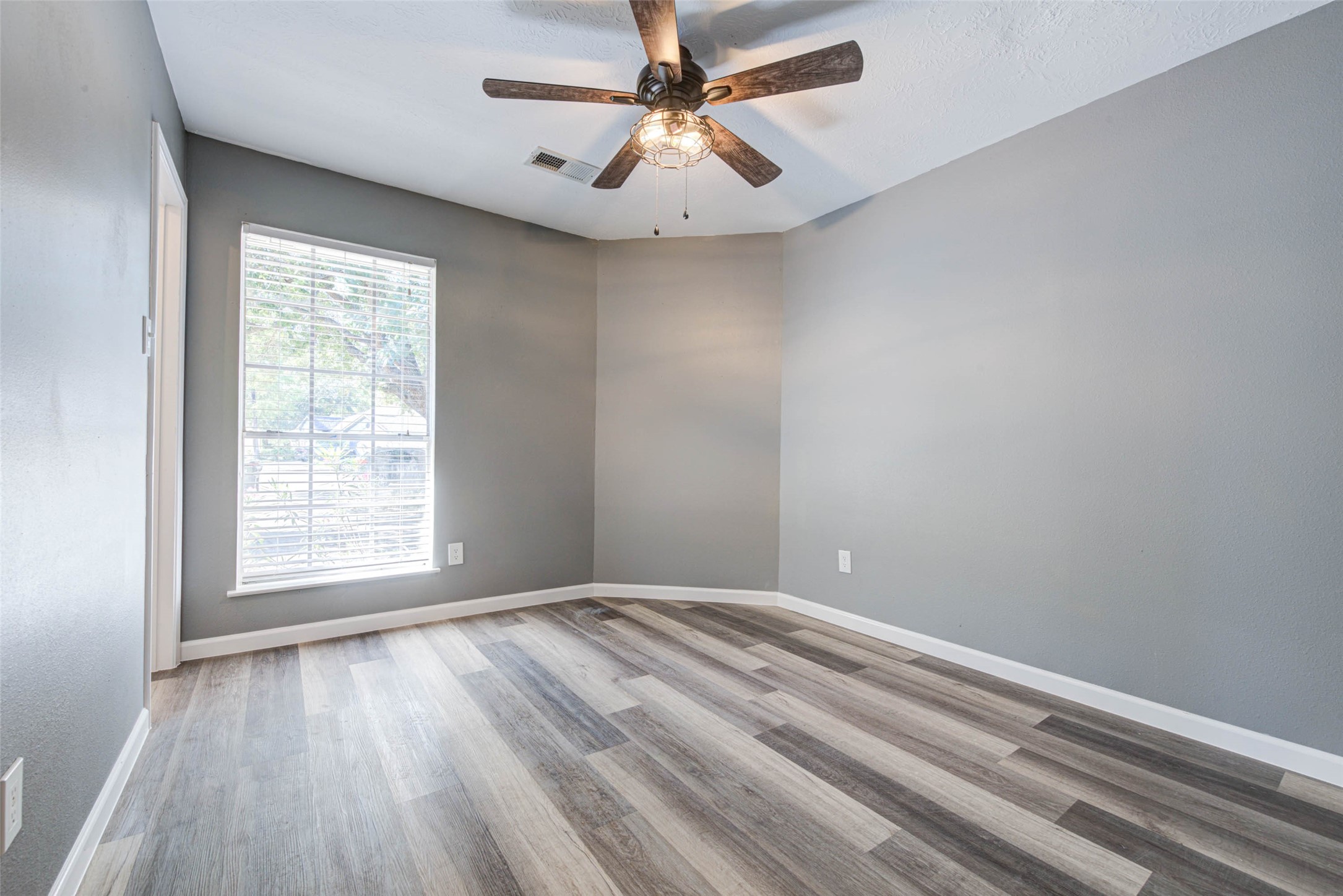 17930 Seven Pines Drive Spring, TX 77379 - Photo 20 of 26 wooden floor in an empty room with a window