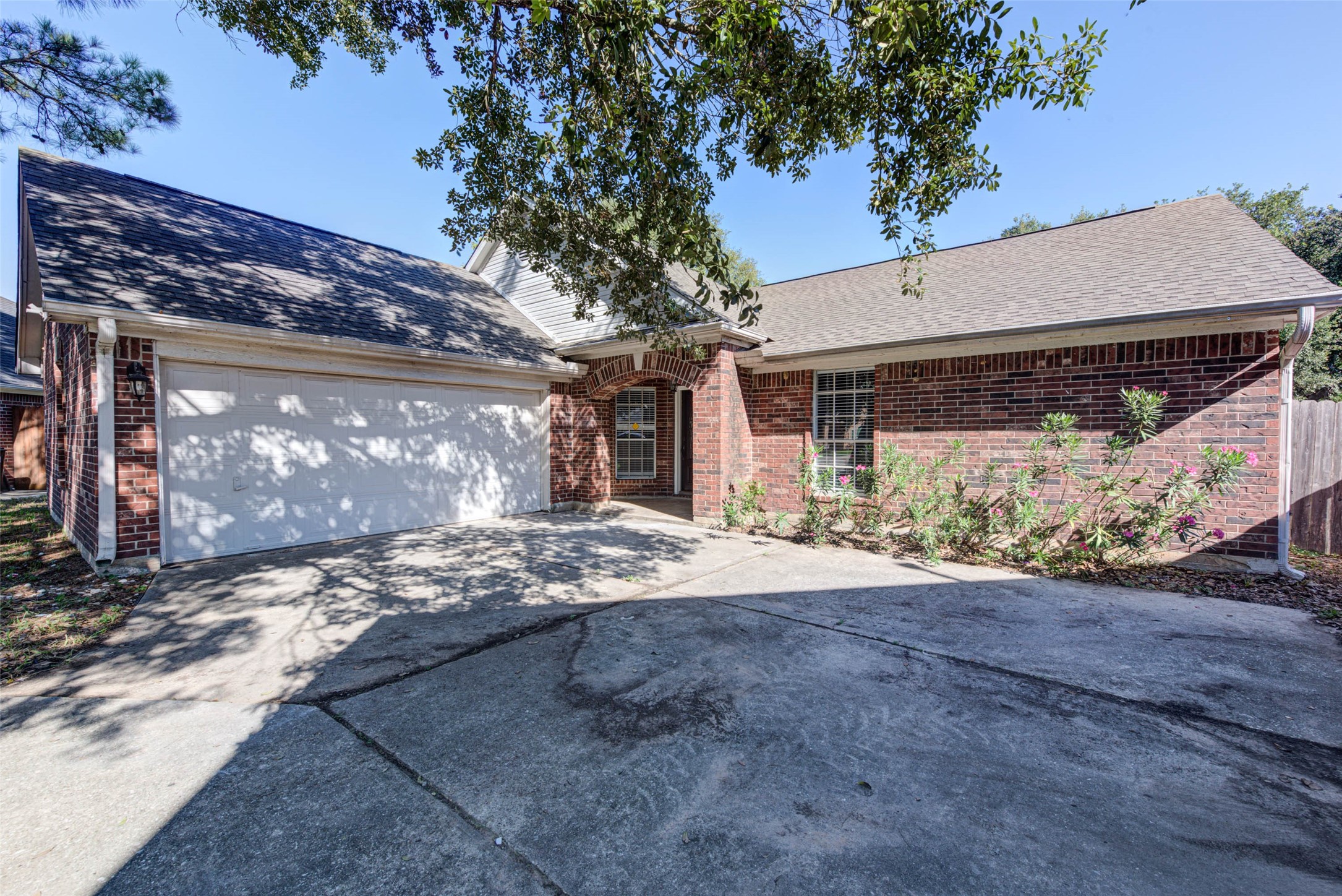 17930 Seven Pines Drive Spring, TX 77379 - Photo 2 of 26 a view of a house with a trees