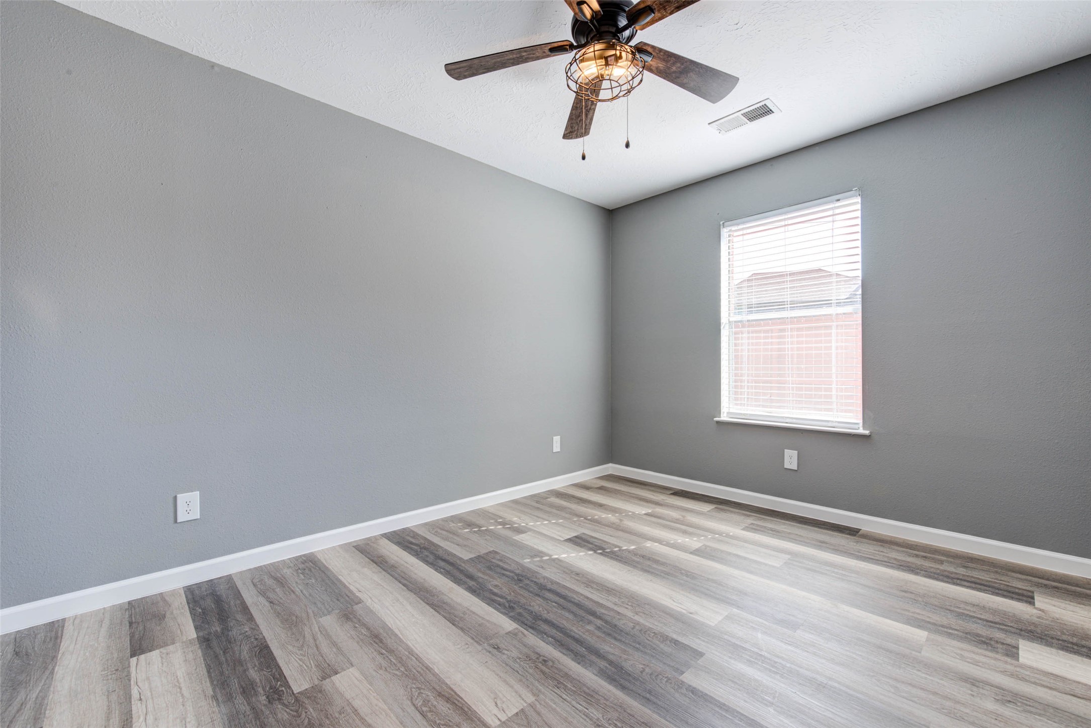 17930 Seven Pines Drive Spring, TX 77379 - Photo 22 of 26 a view of room with window and ceiling fan