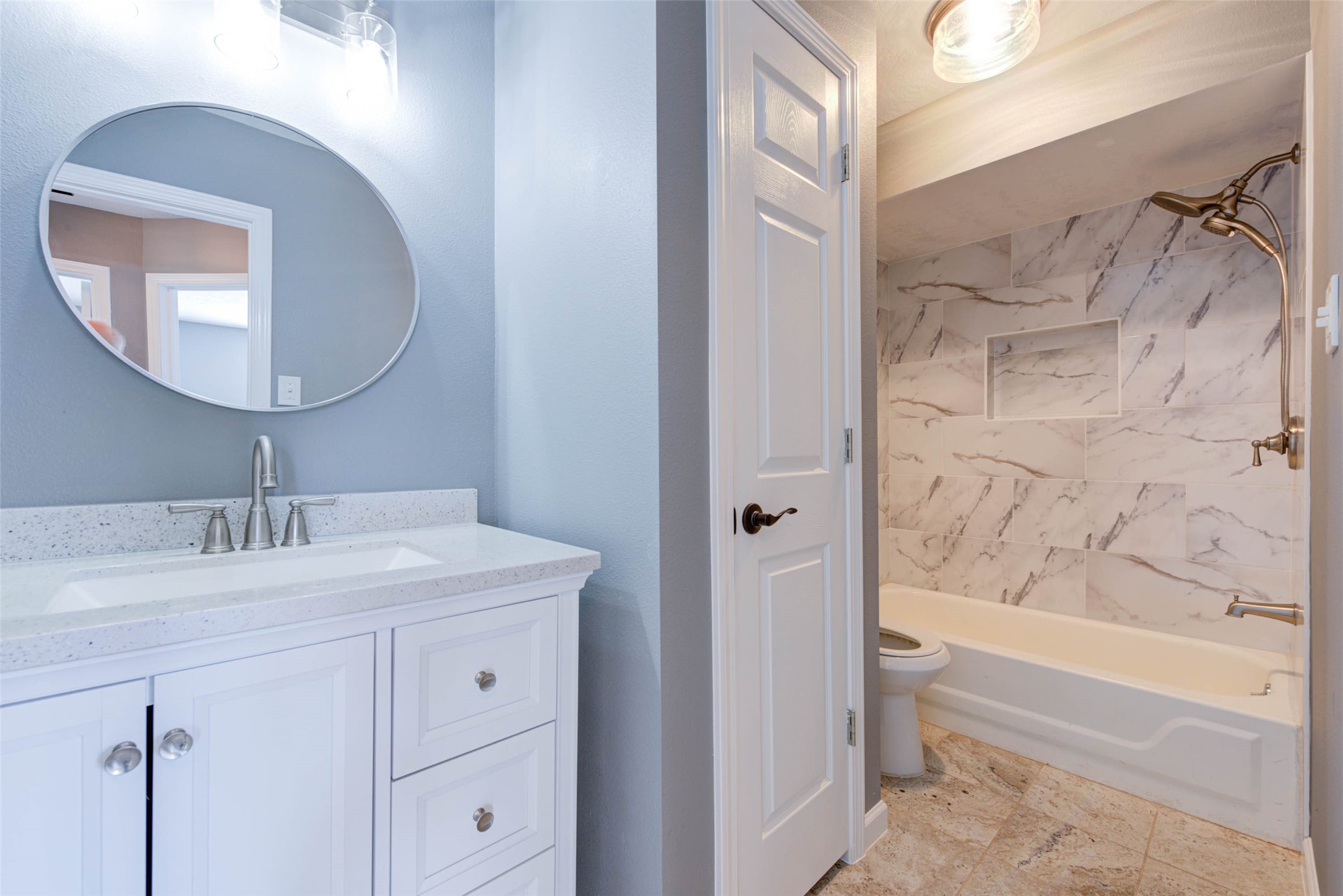 17930 Seven Pines Drive Spring, TX 77379 - Photo 23 of 26 a bathroom with a granite countertop sink a toilet and bathtub