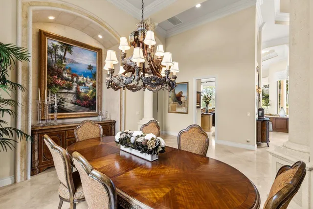 a living room with lots of furniture and a large window