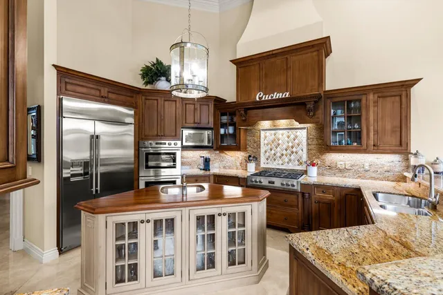 a living room with furniture a flat screen tv and a large window