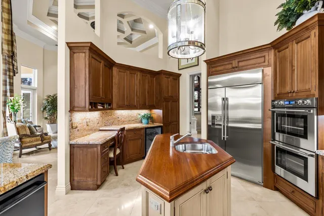 a living room with furniture a potted plant and a fireplace