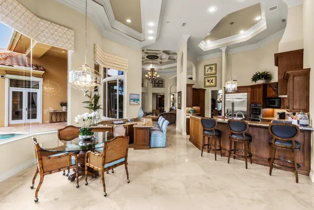 a spacious bedroom with a bed and a large window