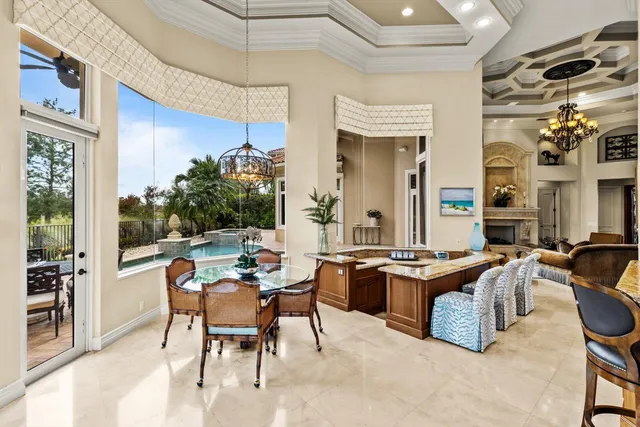 a kitchen with a stove and white cabinets
