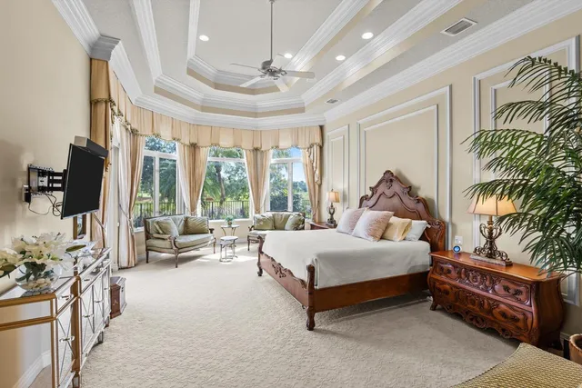a bathroom with a granite countertop sink a toilet and a mirror