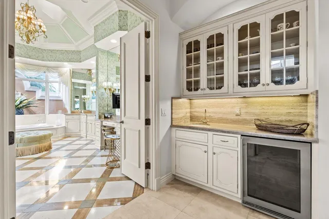 a bathroom with a granite countertop toilet sink and mirror