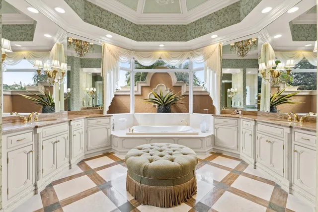 a bathroom with a granite countertop sink a toilet and a mirror