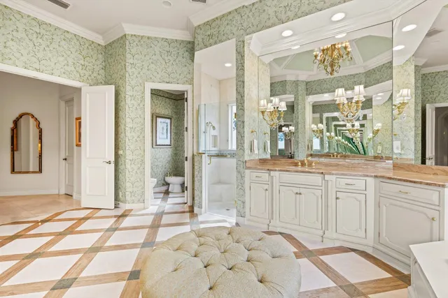 an aerial view of a house with a yard and trees all around