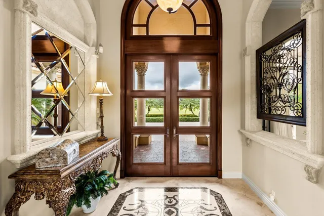 a view of a dining room with furniture and a window