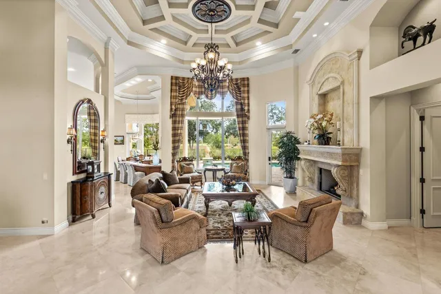 a dining room with furniture and chandelier